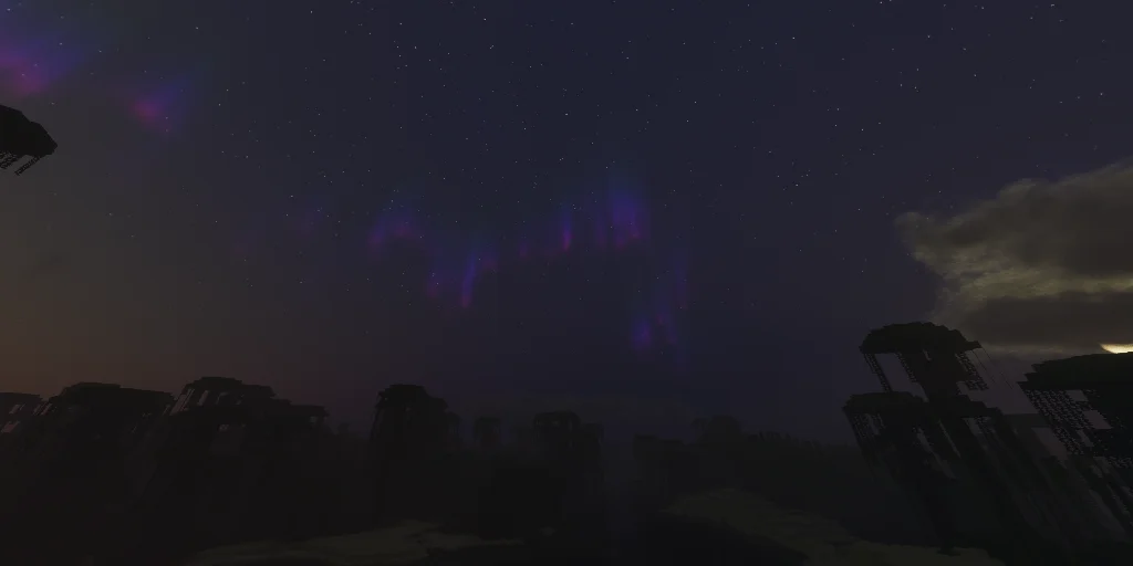 Night sky with purple aurora bands over dark badlands spires
